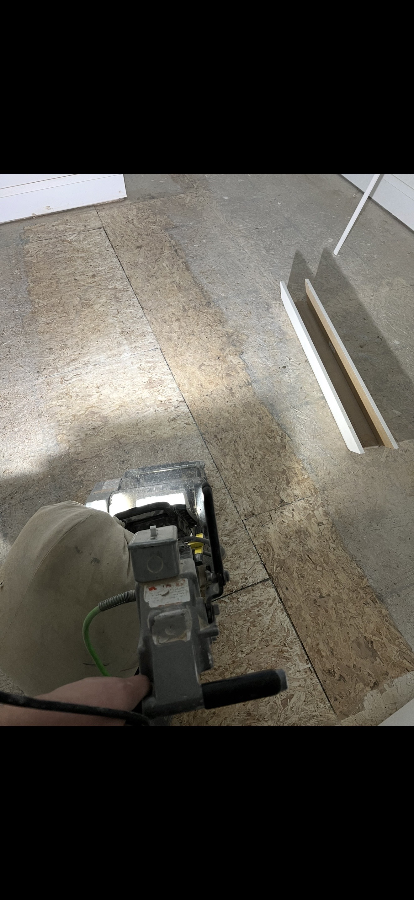 Subfloor sanding in progress